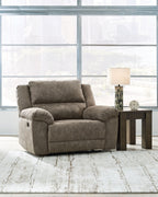 Fossil gray wide seat recliner with reclined back and curved armrests