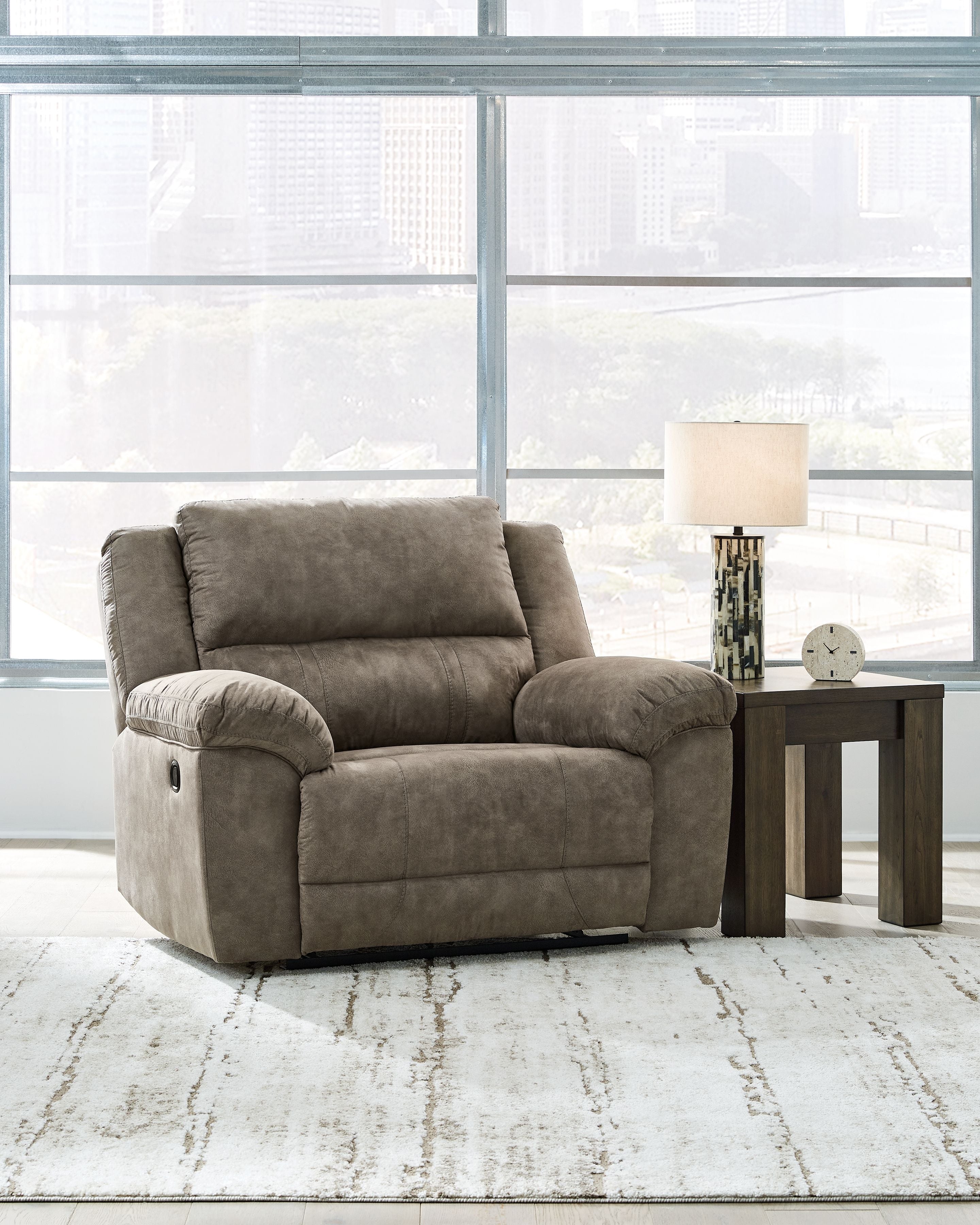 Fossil gray wide seat recliner with reclined back and curved armrests
