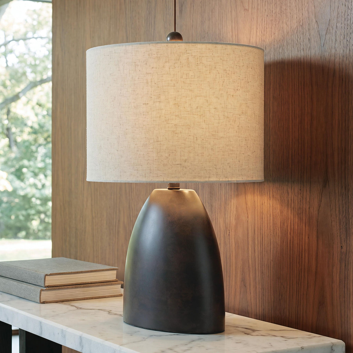 Antique black table lamp with beige drum shade and round finial