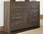 Dark brown wood dresser with 2 doors, 6 drawers, and metal bar pulls