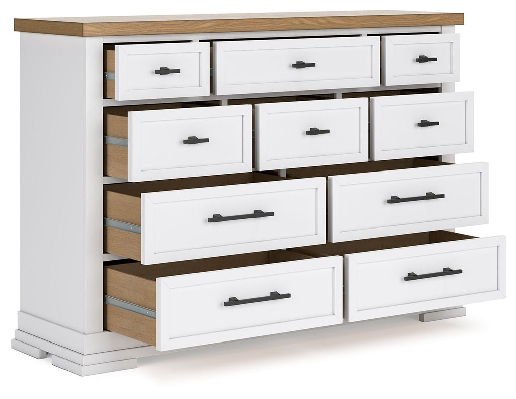 White dresser with black handles, natural wood top, side opening with shelving.