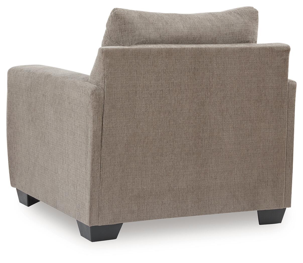 Loreo chair in light brown beige fabric with side profile, boxy arms, and dark feet