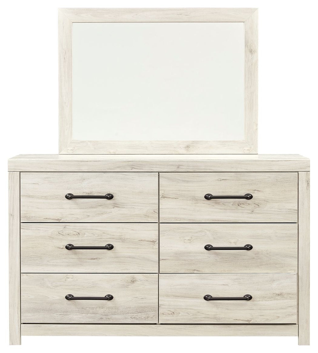 Beige dresser with attached mirror and six drawers, black bar hardware