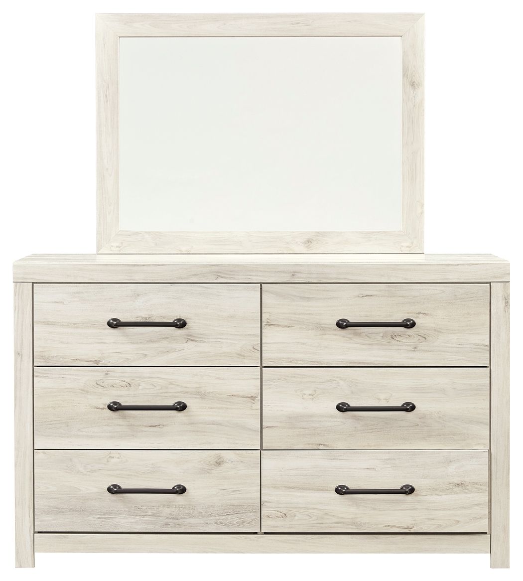Beige dresser with attached mirror and six drawers, black bar hardware