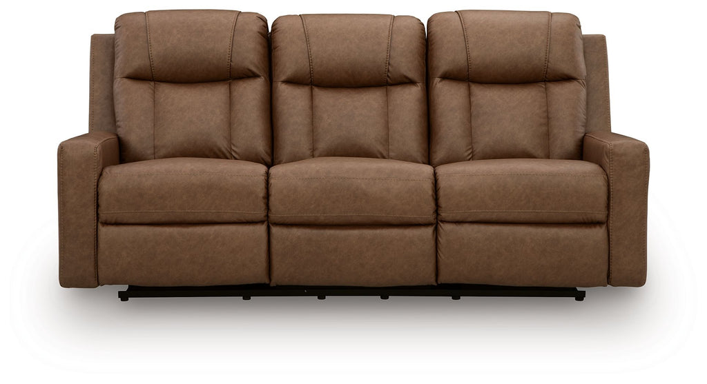Light brown reclining sofa with tall padded back cushions and segmented seat panels