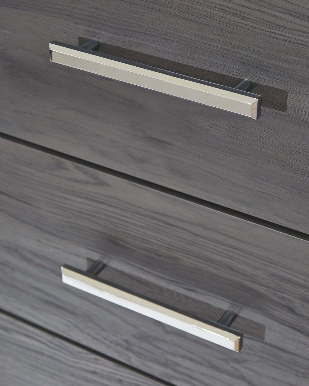 Gray drawer face with two chrome bar handles