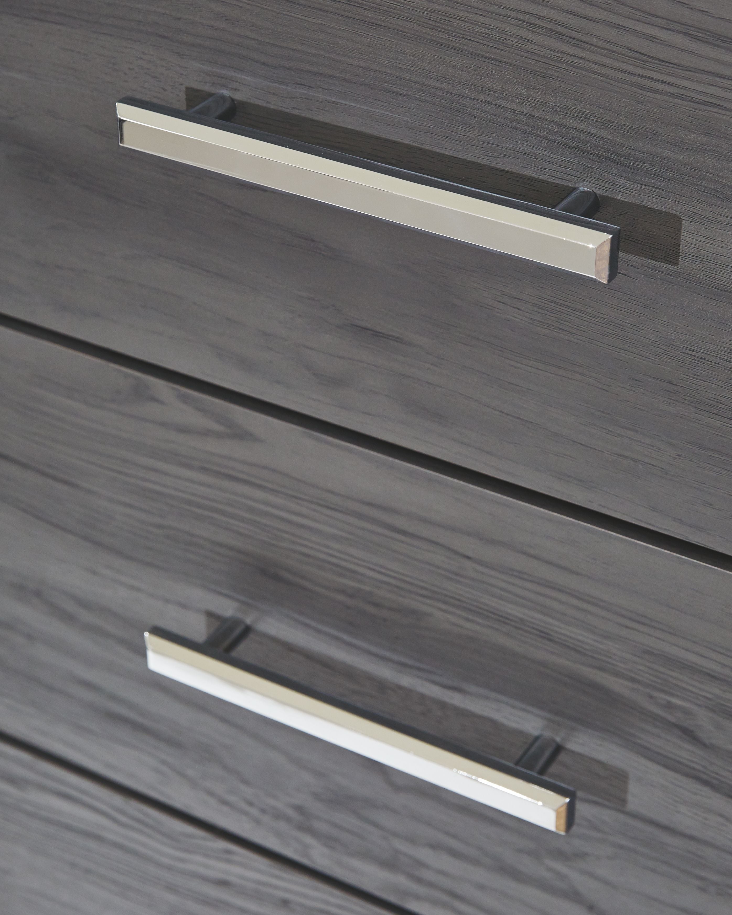 Gray drawer face with two chrome bar handles