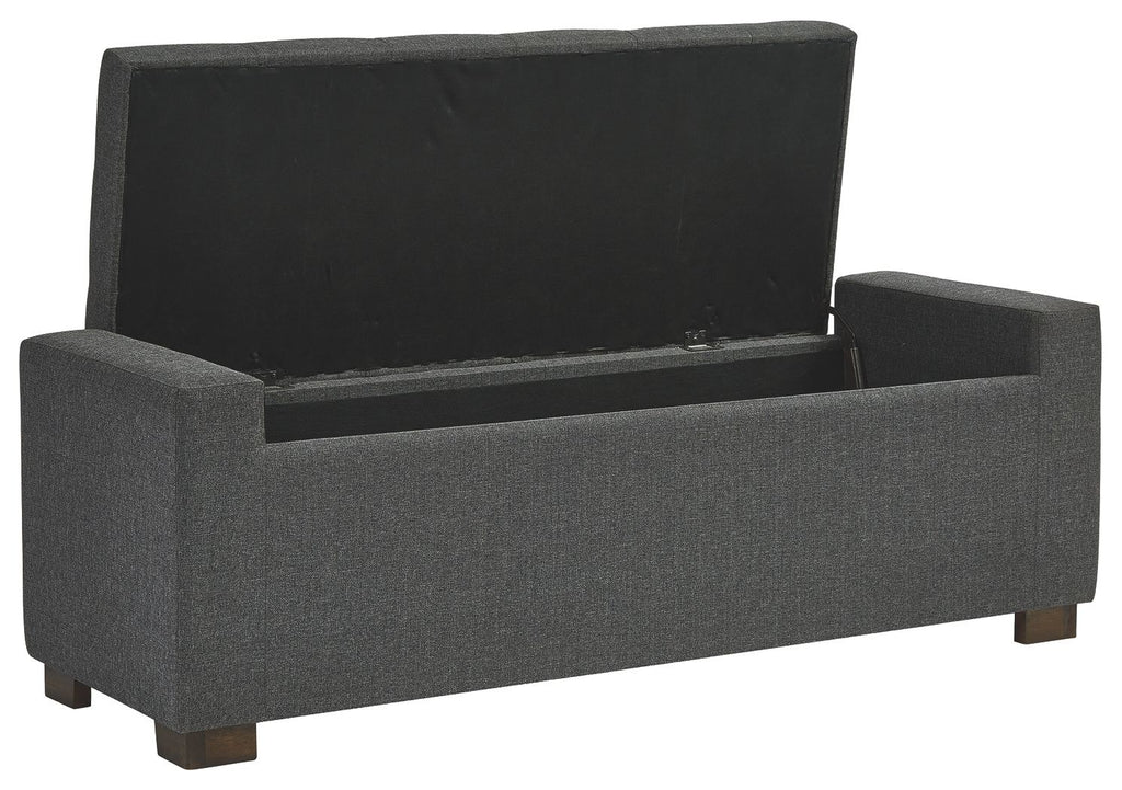 Gray upholstered storage bench with hinged flip-top lid and padded sides