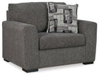 Textured gray chair and a half with rolled arms and square seat, includes patterned pillow