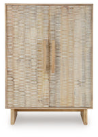 Natural accent cabinet with two woven rattan doors and brass-tone vertical handles