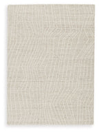 Cream rug with subtle linear wave pattern across the surface
