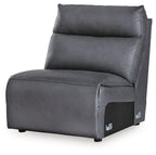 Dark blue armless chair with padded back cushion, stitched seat, and side arm panels