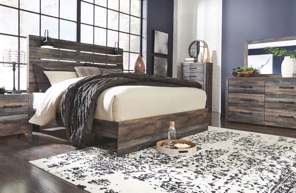 Panel bed with dark wood frame and panel headboard, styled with light and dark bedding