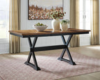 Dark brown dining table with extension leaves and black metal base in a living room
