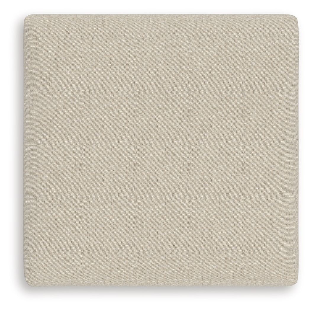 Light beige square ottoman cushion with smooth twill-like fabric texture