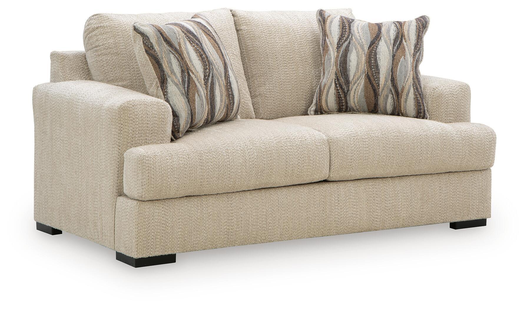 Beige loveseat with squared arms, two seat cushions, and two striped accent pillows