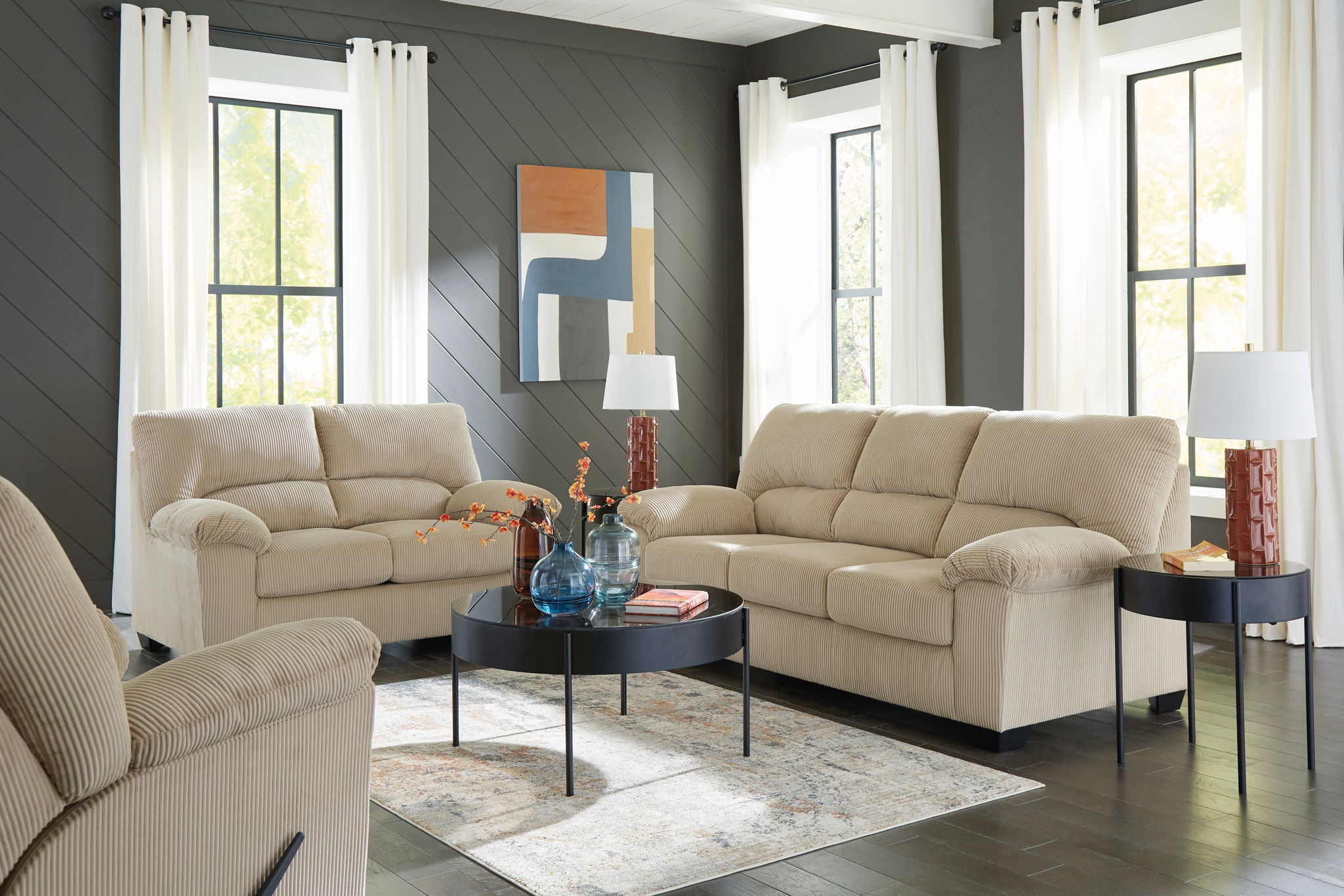 Beige sofa set with cushioned seats and square arms