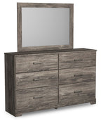 Gray wood dresser with mirror and six drawers, metal bar pulls
