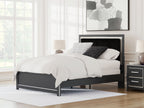 Dark upholstered panel bed with padded headboard and white bedding, shown in a bright room