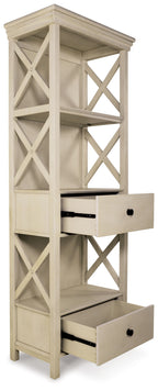Antique white display cabinet with open shelves and two drawers, side view