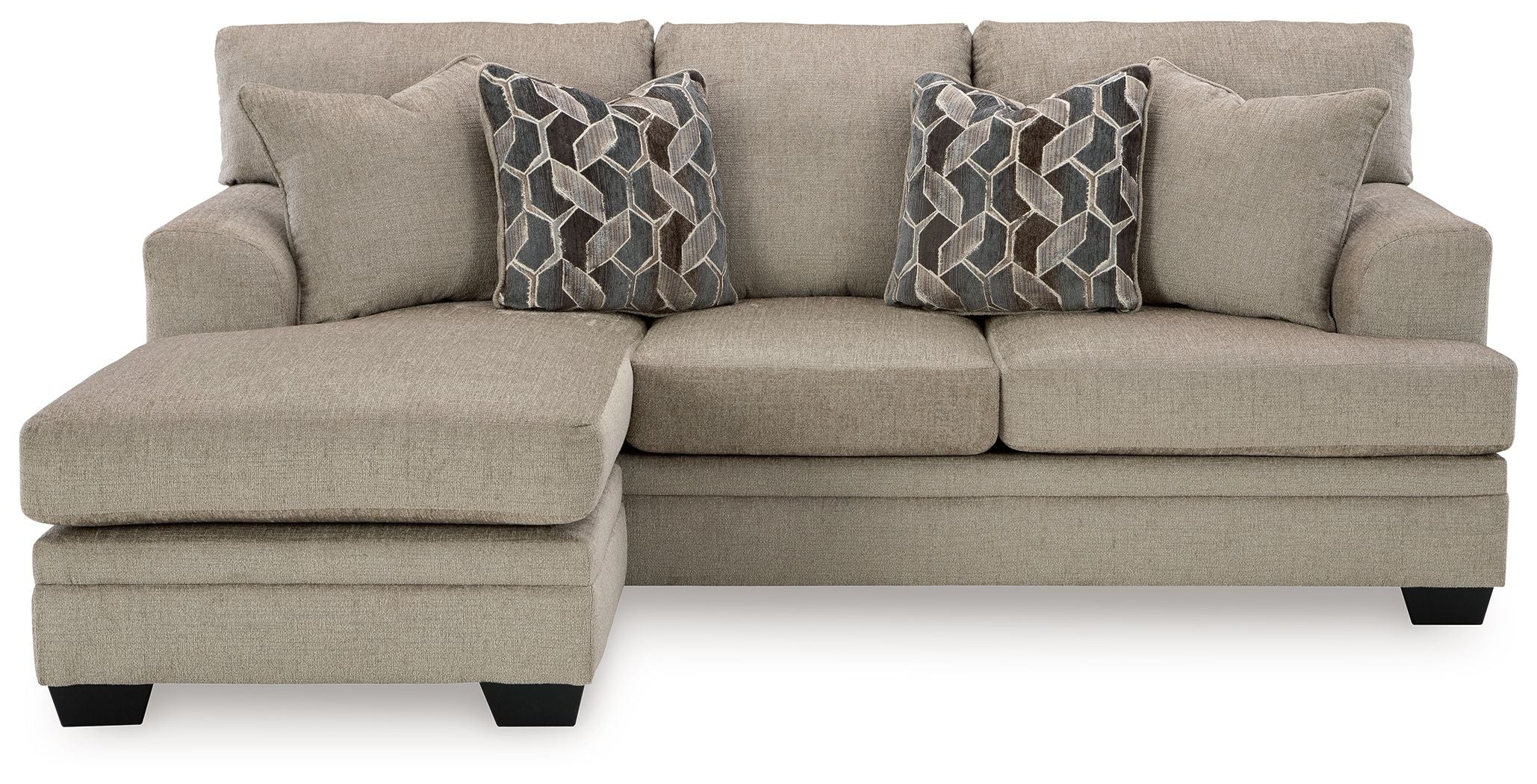 Taupe sofa chaise with three seat cushions and two geometric patterned throw pillows