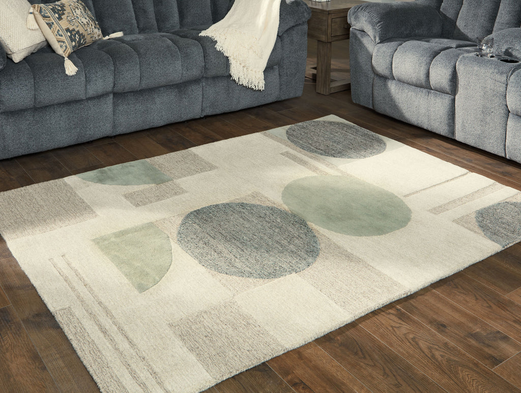 Ivory rug with abstract circles in gray and sage, low pile texture