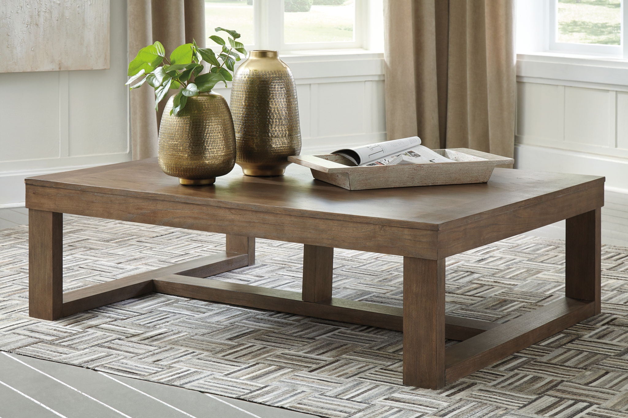 Gray rectangular cocktail table with open shelf, solid legs, and smooth top