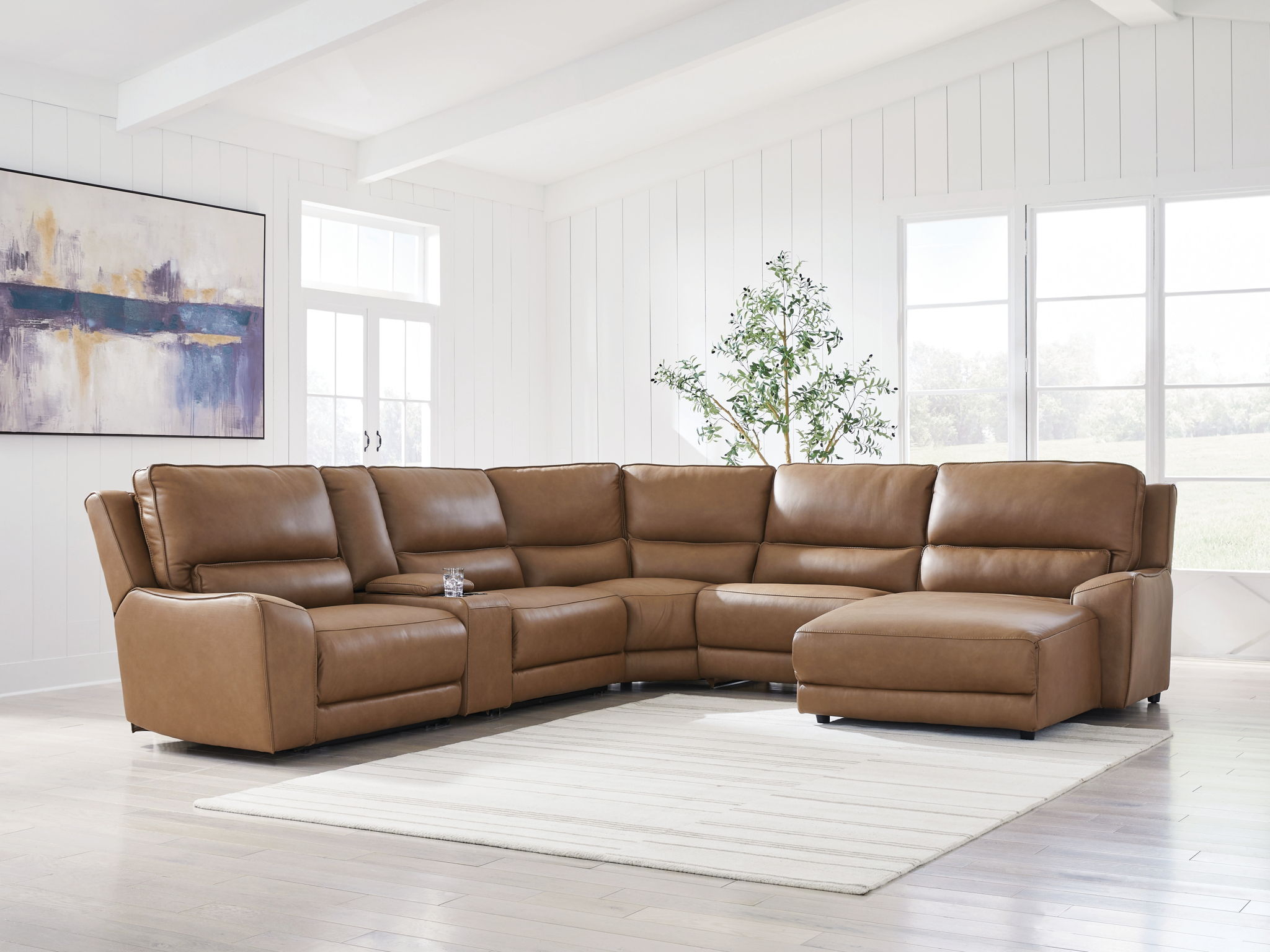 Caramel power reclining sectional sofa with chaise and multiple headrest sections