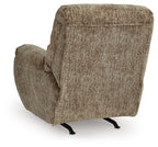 Taupe rocker recliner chair with curved back, thick armrests, and angled foot base