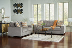 Gray fabric living room set with two seating pieces and patterned throw pillows