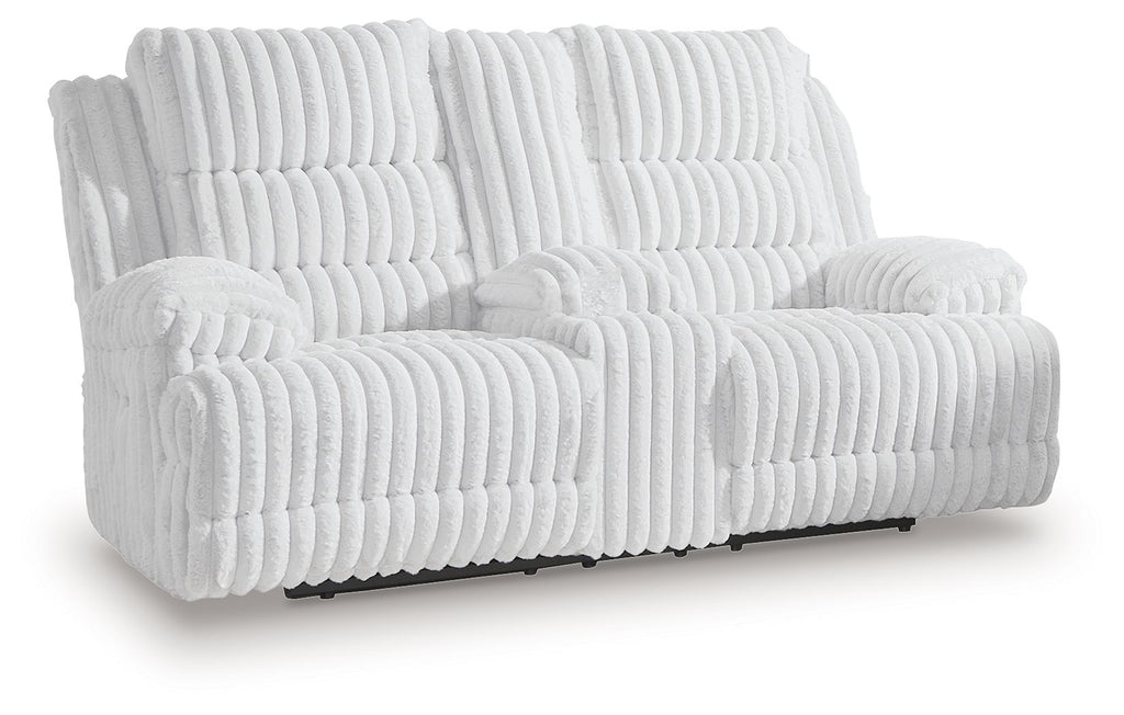 White channel-tufted double reclining loveseat with padded armrests, extended footrests