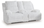 White channel-tufted double reclining loveseat with padded armrests, extended footrests