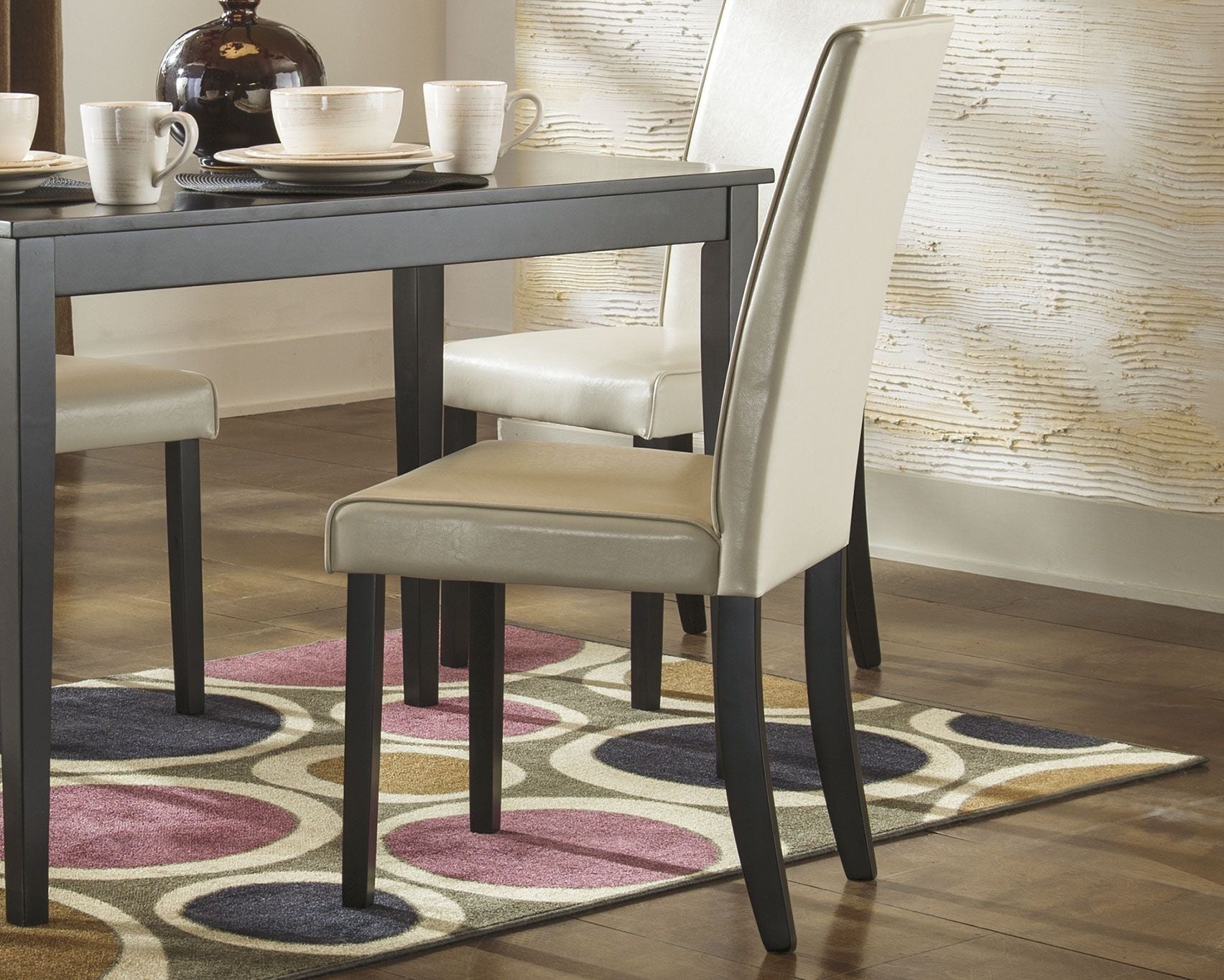 Dining side chair in pearl silver upholstery with dark frame and straight legs
