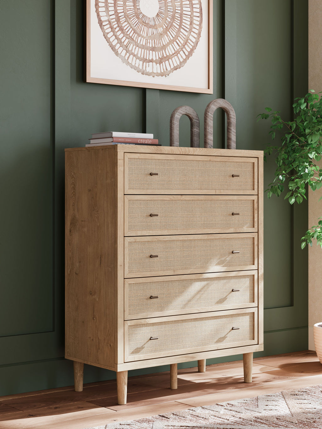 Five-drawer wide chest with woven light fronts, dark handles, angled side panel
