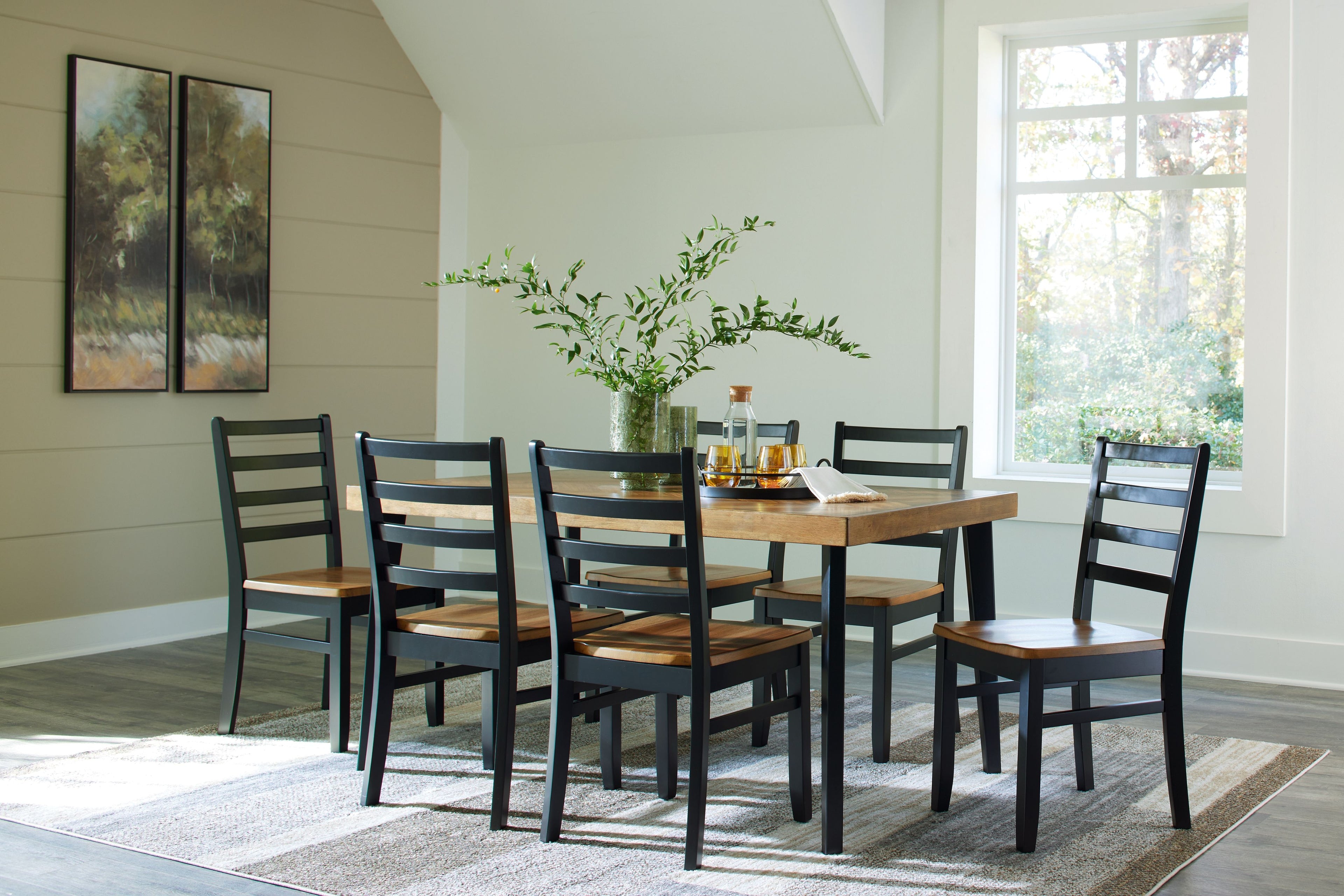 Rectangular dining table with brown top and black slat-back chairs