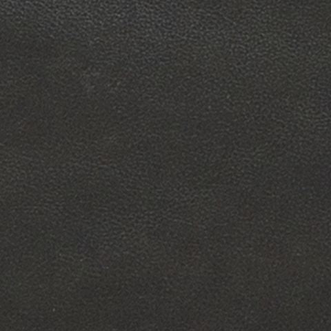 Close-up of dark textured upholstery fabric on a sofa cushion