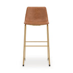 Tall upholstered barstool, light brown upholstery, straight gold legs with footrest rails.