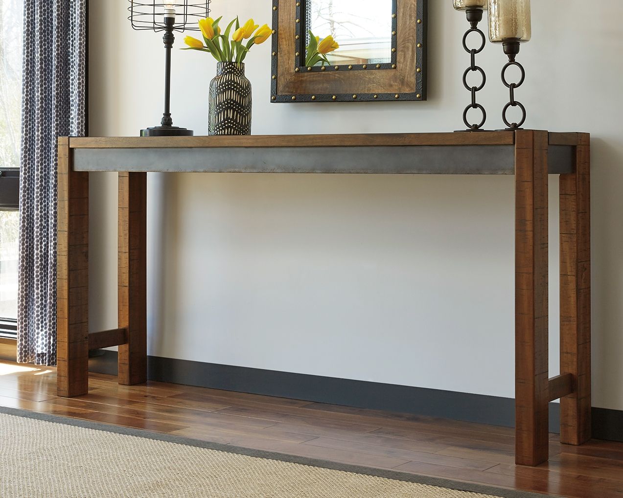 Dark brown long counter table with lower shelf and side cross braces.