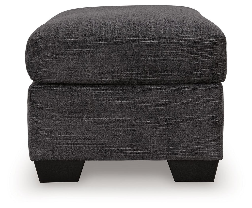 Gray fabric ottoman with rounded-corner top cushion and black legs