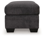 Gray fabric ottoman with rounded-corner top cushion and black legs