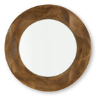 Brown round accent mirror with carved wood frame and reflective glass center