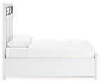 White panel storage bed, side view with raised panel headboard and boxy frame