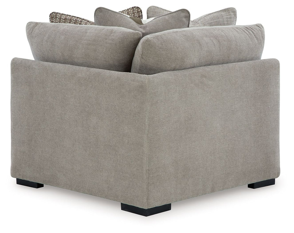 Aslan Court wedge sectional chair in light gray upholstery with stacked back cushions