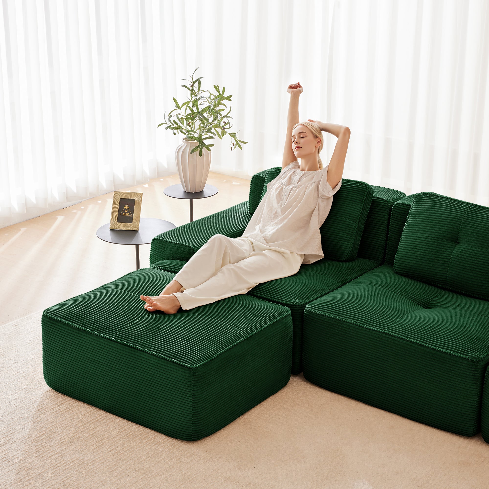 Green corduroy modular sectional sofa with chaise ottoman and back cushions