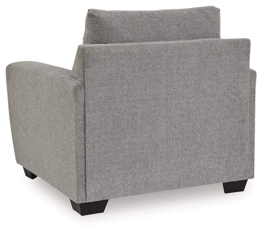 Gray upholstered armchair with square arms and cushioned back