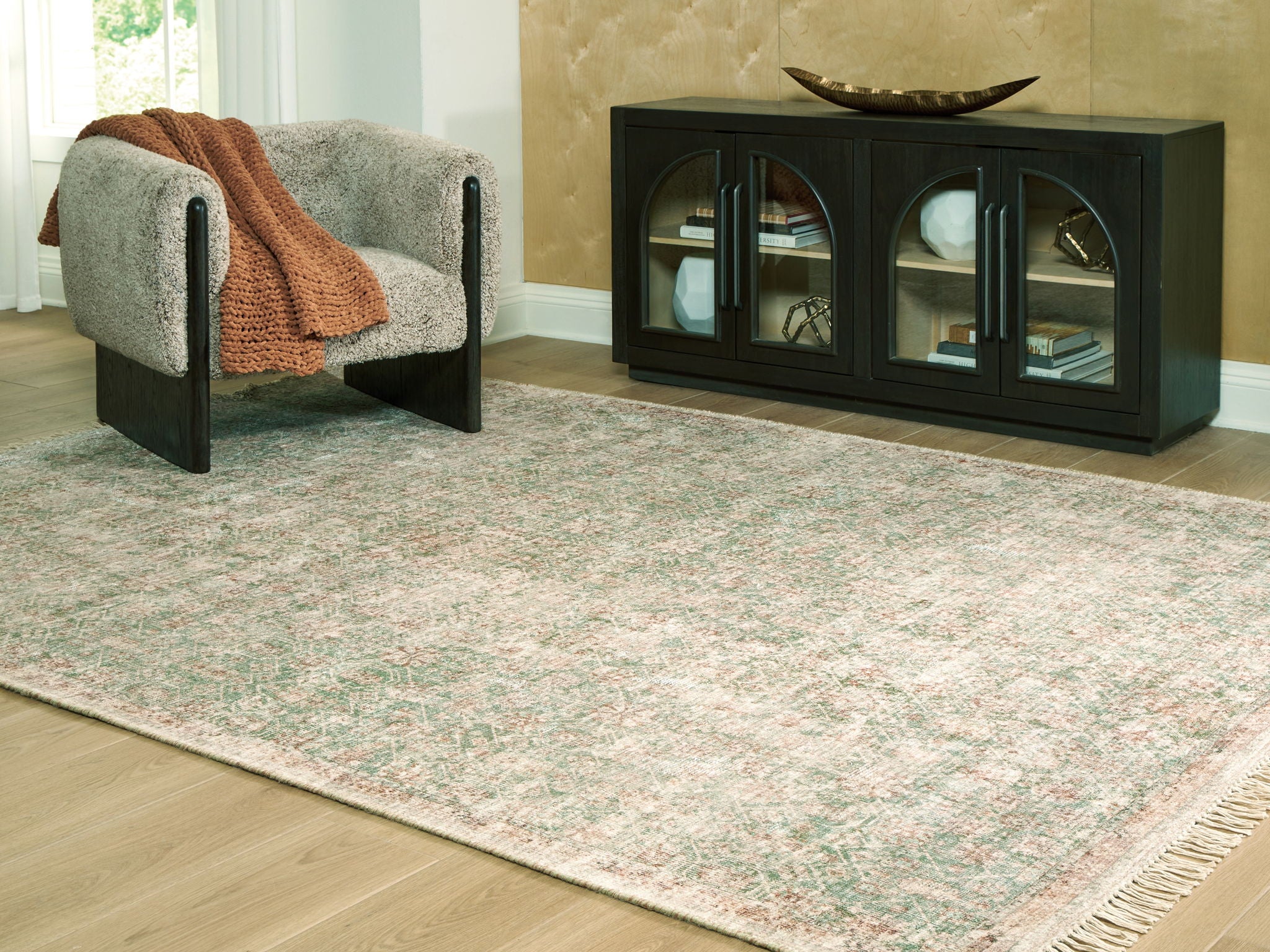 Rossbury rug, light beige with green and rust-speckled pattern, textured flat weave