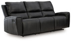 Black reclining sofa with padded arms and tufted back cushions