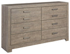 Gray wood dresser with six drawers and metal bar pull handles
