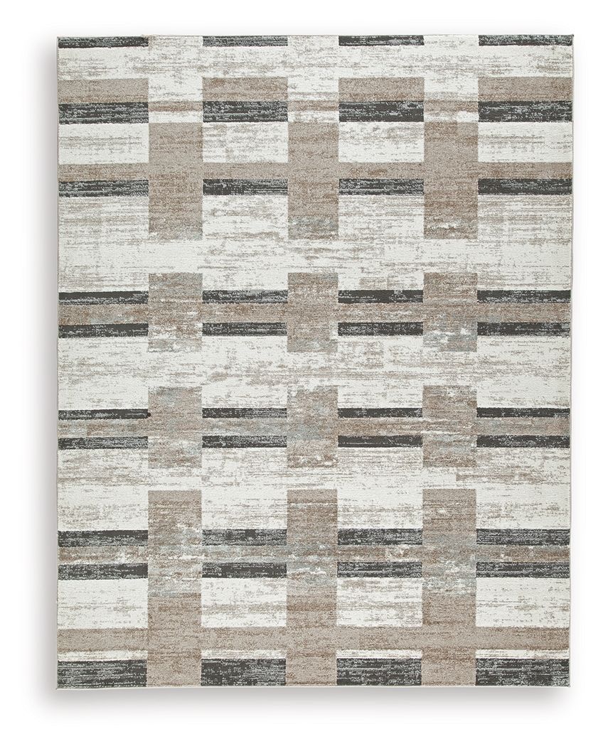 Beige abstract block pattern area rug with dark gray accents