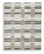 Beige abstract block pattern area rug with dark gray accents